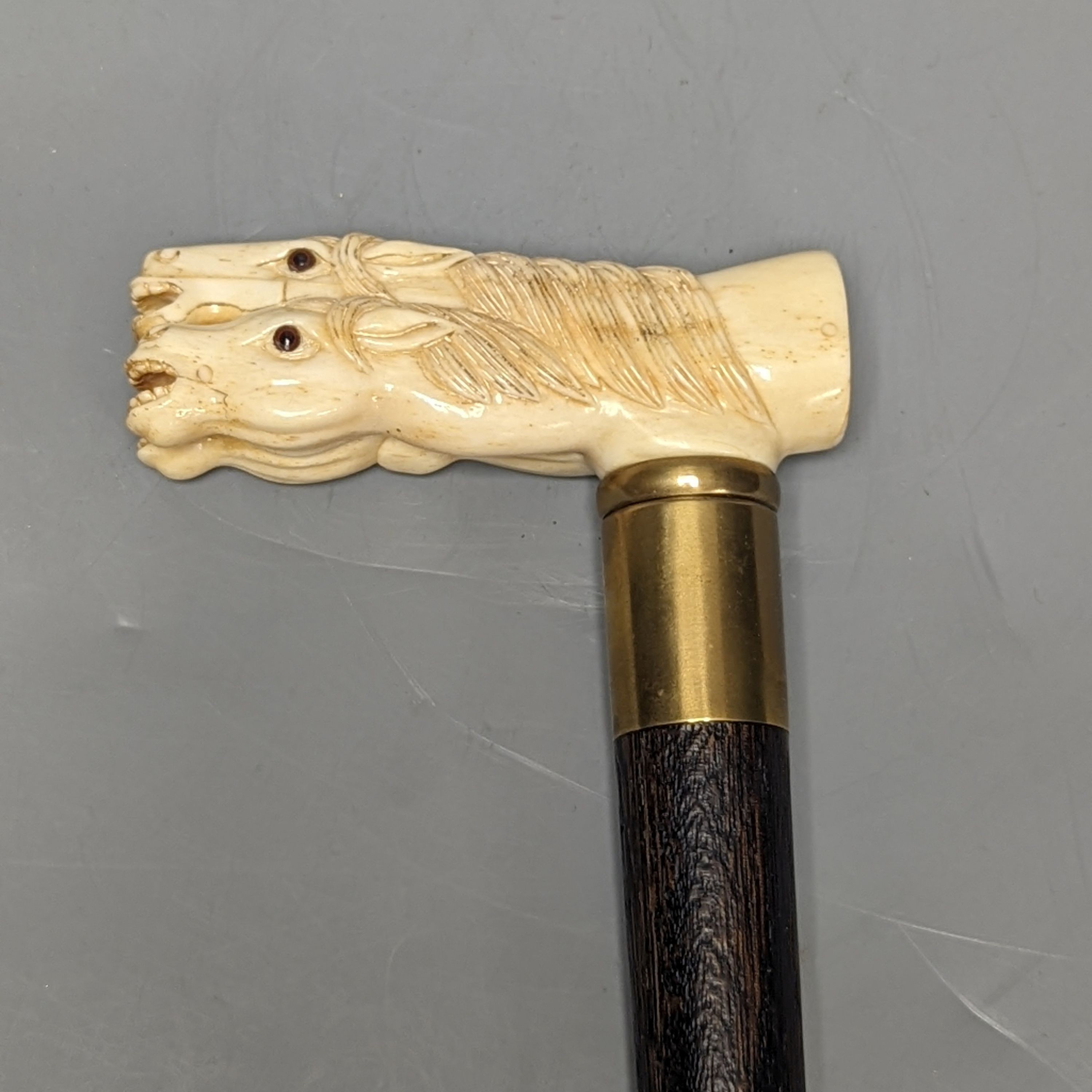 A bone 'horse head' handled walking stick 90cm